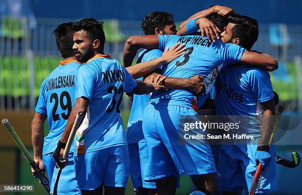 Manpreet Singh, Rupinder Pal Singh, Chinglensana Kangujam, and Chandanda Thimmaiah of India react to a goal during a Pool B match between Ireland and...