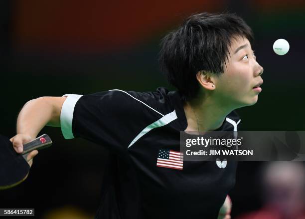 S Yue Wu hits a shot in her women's singles qualification round table tennis match at the Riocentro venue during the Rio 2016 Olympic Games in Rio de...