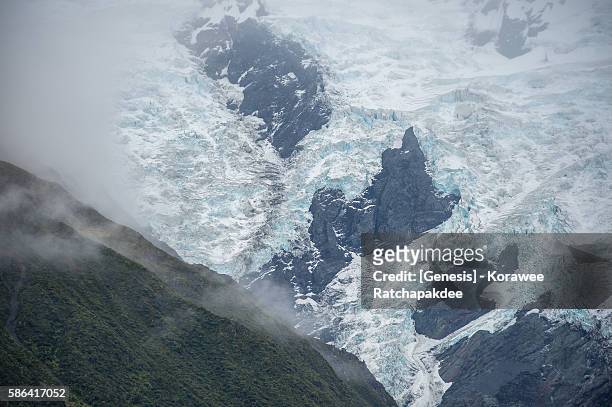 the glacier mountain in the misty day - new zealand imagens e fotografias de stock