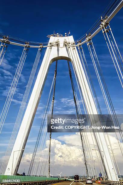 passing on the cable stayed bridge - incheon international airport stock pictures, royalty-free photos & images