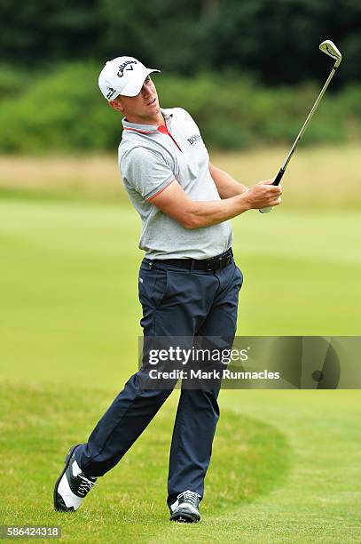 Alex Noren of Sweden takes his second shot on hole 14 on day three of the Aberdeen Asset Management Paul Lawrie Matchplay at Archerfield Links Golf...