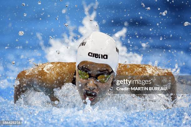 Refugee Olympic Team's Yusra Mardini takes part in the Women's 100m Butterfly heat during the swimming event at the Rio 2016 Olympic Games at the...