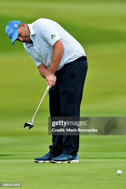 Anthony Wall of England takes a putt on the green on hole 18 on day three of the Aberdeen Asset Management Paul Lawrie Matchplay at Archerfield Links...