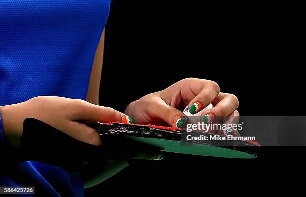 Mouma Das of India plays a Women's Singles first round match against Daniela Monteiro Dodean of Romania on Day 1 of the Rio 2016 Olympic Games at...