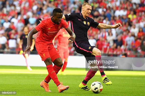 Divock Origi of Liverpool scores his team's third goal during the International Champions Cup match between Liverpool and Barcelona at Wembley...