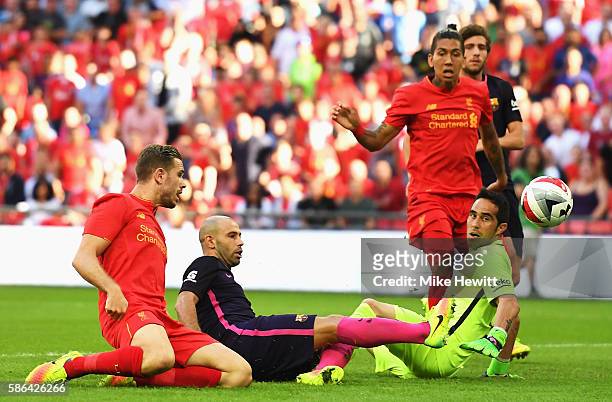 Javier Mascherano of Barcelona scores an own goal for Liverpool's second goal during the International Champions Cup match between Liverpool and...