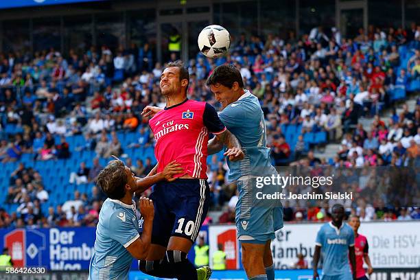 Pierre-Michel Lasogga of Hamburg challenges Philipp Wollscheid of Stoke City during the pre-season friendly match between Hamburger SV and Stoke City...