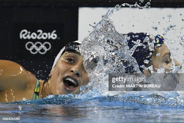 Brazil's Daynara De Paula takes part in the Women's 100m Butterfly heat during the swimming event at the Rio 2016 Olympic Games at the Olympic...