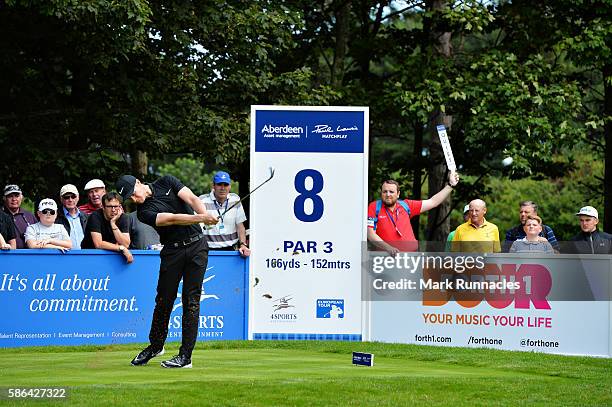 Oliver Fisher of England takes his tee shot on hole 8 on day three of the Aberdeen Asset Management Paul Lawrie Matchplay at Archerfield Links Golf...