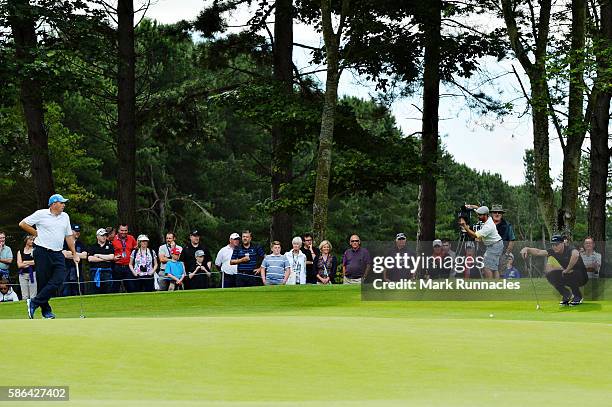 Oliver Fisher of England and Anthony Wall of England look at their putts on hole 6 on day three of the Aberdeen Asset Management Paul Lawrie...