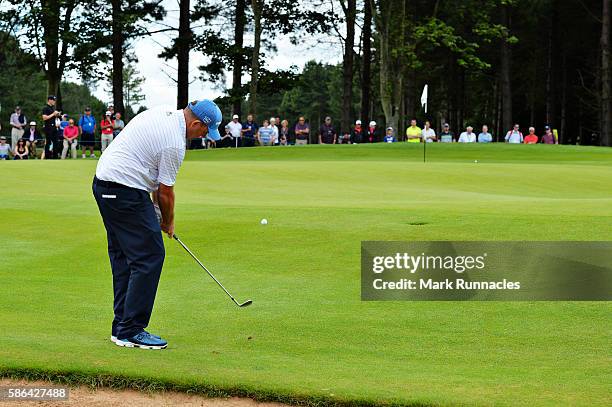 Anthony Wall of England chips on hole 6 on day three of the Aberdeen Asset Management Paul Lawrie Matchplay at Archerfield Links Golf Club on August...