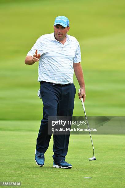 Anthony Wall of England reacts to the crowds applause after holing out on hole 18 on day three of the Aberdeen Asset Management Paul Lawrie Matchplay...