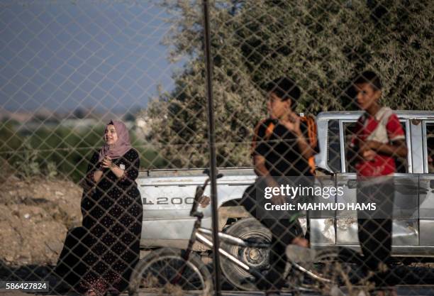 Palestinians attend a protest concert by the band Dawaween, who were denied access to perform at a festival in Jerusalem, in Beit Hanun, near the...