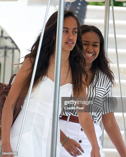 Malia and Sasha Obama depart ahead of their parents United States President Barack Obama and first lady Michelle Obama depart the White House August...