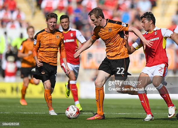 Jon Dadi Bodvarsson of Wolverhampton Wanderers and Stephen Kelly of Rotherham United during the Sky Bet Championship match between Rotherham United v...