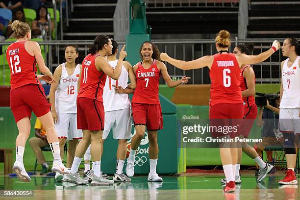 Nayo Raincock-Ekunwe of Canada celebrates with teammates after scoring against China during a Women's Basketball Preliminary Round game on Day 1 of...