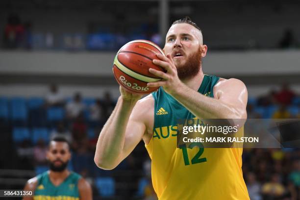 Australia's forward Aron Baynes shoots a free throw during a Men's round Group A basketball match between Australia and France at the Carioca Arena 1...