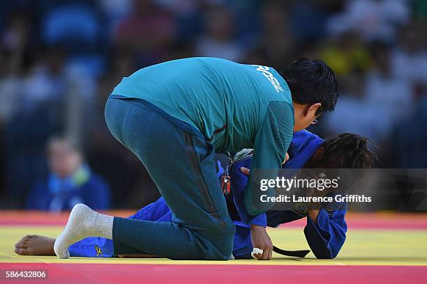 Sarah Menezes of Brazil reacts after being defeated by Urantsetseg Munkhbat of Mongolia during the women's -48kg judo contest on Day 1 of the Rio...