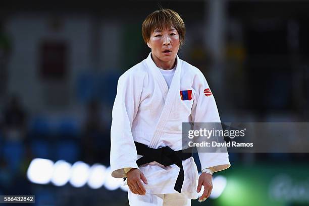 Urantsetseg Munkhbat of Mongolia reacts after defeating Sarah Menezes of Brazil during the Women's -48 kg Repechage Judo contest on Day 1 of the Rio...