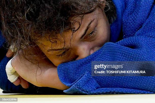 Brazil's Sarah Menezes reacts after loosing the women's -48kg judo contest repechage match against Mongolia's Urantsetseg Munkhbat during the Rio...