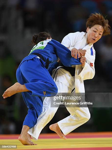 Urantsetseg Munkhbat of Mongolia competes against Sarah Menezes of Brazil during the women's -48kg judo contest on Day 1 of the Rio 2016 Olympic...
