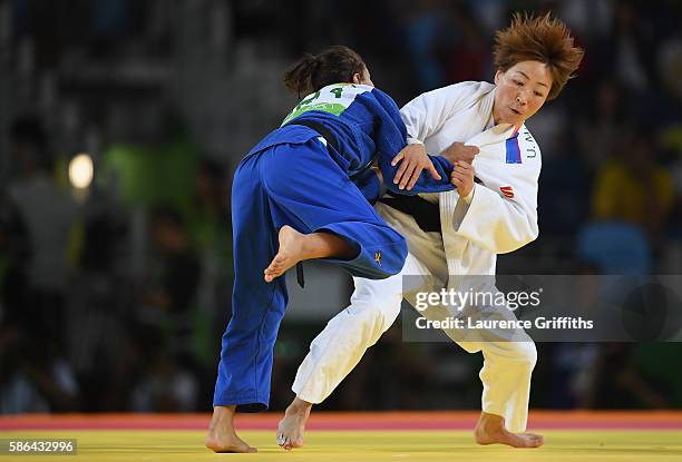 Urantsetseg Munkhbat of Mongolia competes against Sarah Menezes of Brazil during the women's -48kg judo contest on Day 1 of the Rio 2016 Olympic...