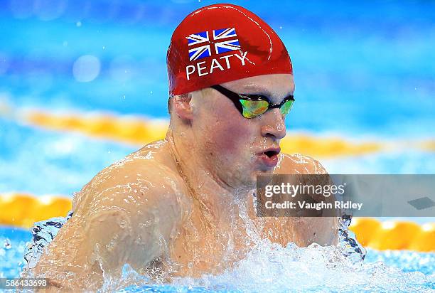 Adam Peaty of Great Britain wins his heat and sets a new World Record in the Men's 100m Breaststroke Heats on Day 1 of the Rio 2016 Olympic Games at...