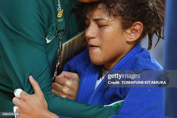 Brazil's Sarah Menezes reacts after loosing the women's -48kg judo contest repechage match against Mongolia's Urantsetseg Munkhbat during the Rio...