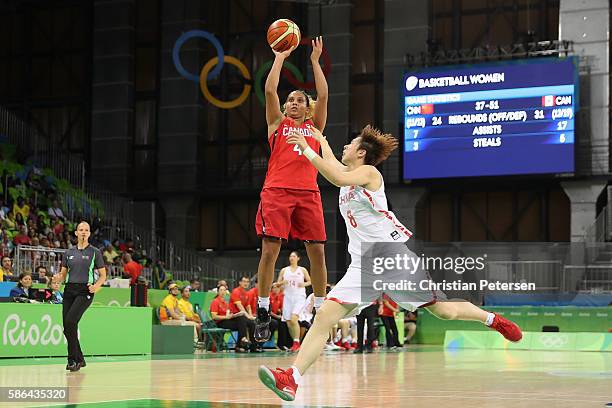Miah-Marie Langlois of Canada attempts a shot over Di Wu of China during a Women's Basketball Preliminary Round game on Day 1 of the Rio 2016 Olympic...