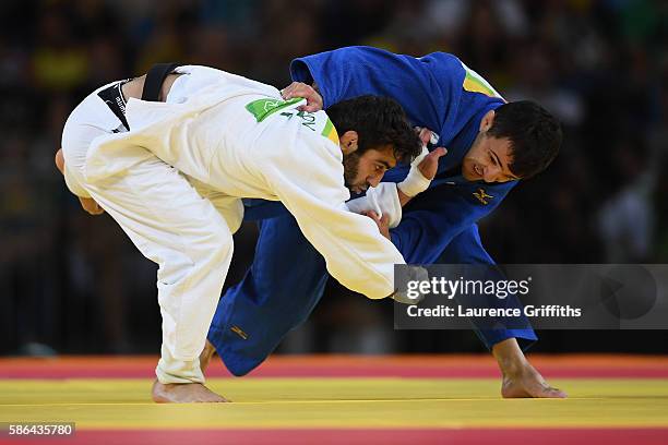 Beslan Mudranov of Russia competes against Amiran Papinashvili of Georgia during the men's -60kg judo contest on Day 1 of the Rio 2016 Olympic Games...