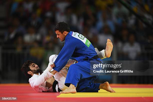 Beslan Mudranov of Russia competes against Amiran Papinashvili of Georgia during the men's -60kg judo contest on Day 1 of the Rio 2016 Olympic Games...