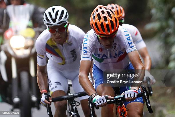 Sergio Luis Henao Montoya of Colombia and Vincenzo Nibali of Italy compete before their crash during the Men's Road Race on Day 1 of the Rio 2016...