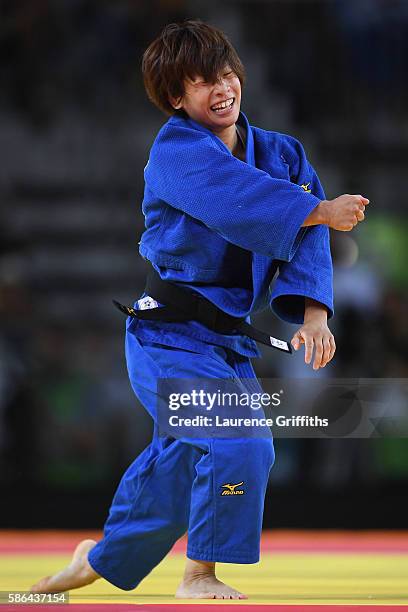 Ami Kondo of Japan reacts after taking down Urantsetseg Munkhbat of Mongolia during the women's -48kg Bronze Medal A judo contest on Day 1 of the Rio...