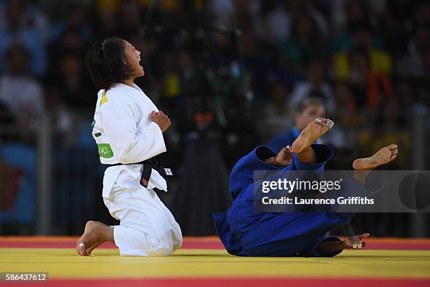 Otgontsetseg Galbadrakh of Kazakhstan reacts after defeating Dayaris Mestre Alvarez of Cuba during the women's -48kb Bronze Medal B judo contest on...