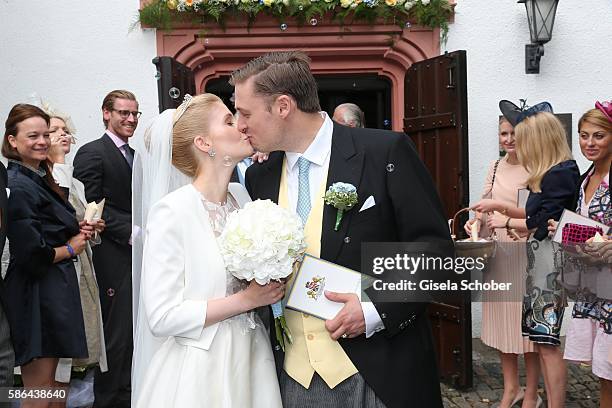 Maximilian Prinz zu Sayn Wittgenstein-Berleburg and his wife Franziska Balzer kiss after the wedding of Prince Maximilian zu...