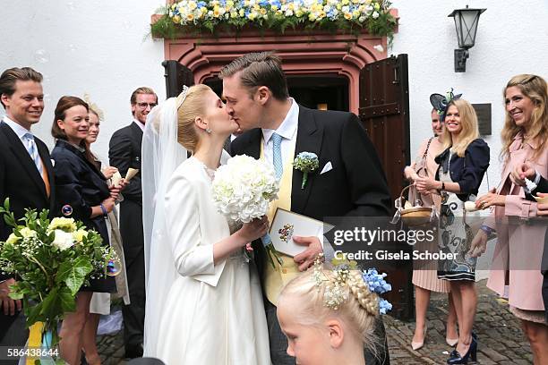 Maximilian Prinz zu Sayn Wittgenstein-Berleburg and his wife Franziska Balzer kiss after the wedding of Prince Maximilian zu...