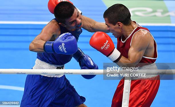 Argentina's Leandro Blanc punches Mexico's Joselito Velazquez during the Men's Light Fly match at the Rio 2016 Olympic Games at the Riocentro -...