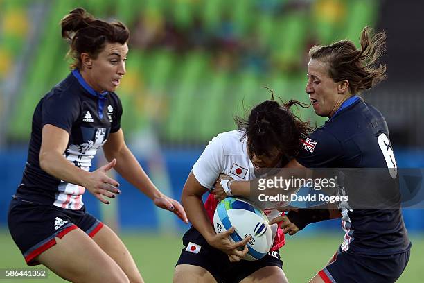 Yume Okuroda of Japan and Katy Mclean of Great Britain compete for the ball during a Women's Pool C rugby match between Great Britain and Japan on...