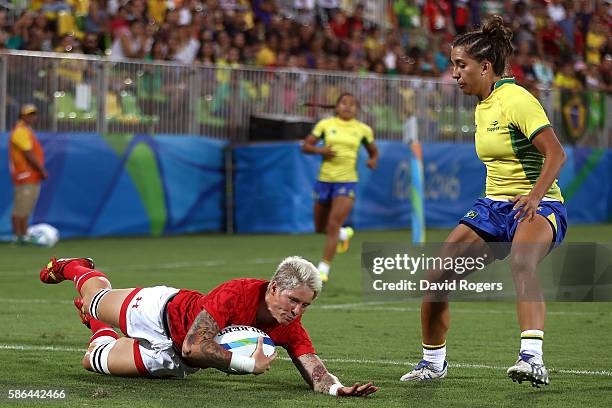 Jennifer Kish of Canada dives to score a try during a Women's Pool C rugby match between Canada and Brazil on Day 1 of the Rio 2016 Olympic Games at...