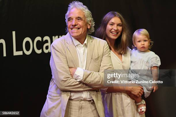 Abel Ferrara, his wife Christina and their daughter attend the Lifetime Achievement Award to Harvey Keitel during the 69th Locarno Film Festival on...