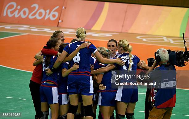 The Russian team celebrate victory during the Women's Hadball match between Russia and Korea on Day 1 of the Rio 2016 Olympic Games at Future Arena...