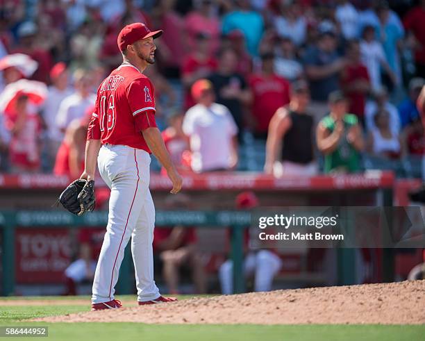 Closing pitcher Huston Street of the Los Angeles Angels of Anaheim reacts after allowing a single to Aaron Hill of the Boston Red Sox during the...