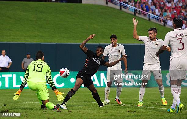 Georginio Wijnaldum of Liverpool FC shoots as Becker Alisson of AS Roma defends during a friendly match at Busch Stadium on August 1, 2016 in St...