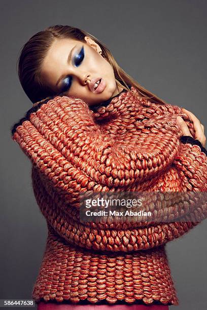 Elizabeth Cabral; Makeup: Hung Vanngo; Hair: Keith Carpenter; Manicure: Alicia Torello. Sweater and pants by Mary Katrantzou. Earrings by Crux.