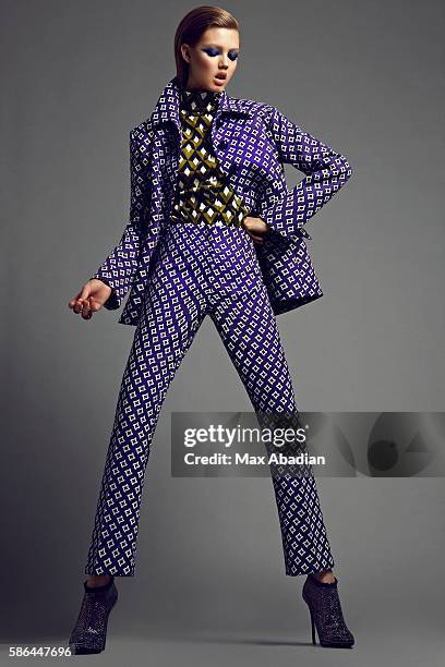 Elizabeth Cabral; Makeup: Hung Vanngo; Hair: Keith Carpenter; Manicure: Alicia Torello. Jacket, shirt, and pants all by Prada. Blue crystal ring by...