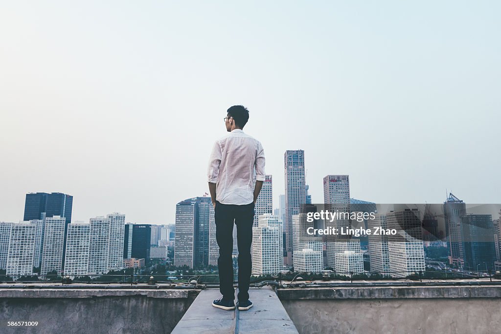 Businessman looking at cityscape