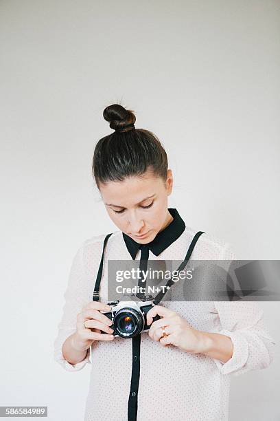 girl holding camera - camera white background stock pictures, royalty-free photos & images