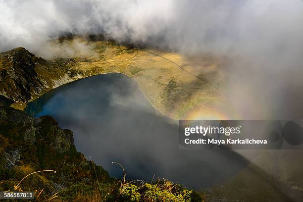 brocken spectre at the seven rila lakes - brocken spectre stock pictures, royalty-free photos & images