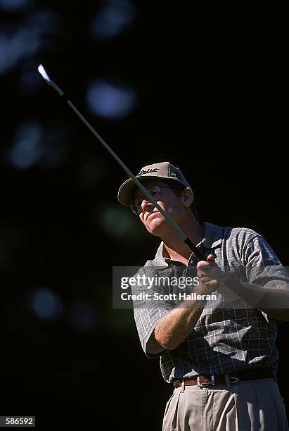 Mike Reid watches the ball after hitting it during the Greater Milwaukee Open at the Brown Dear Park Golf Club in Milwaukee, Wisconsin.Mandatory...