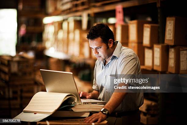 hispanic manager in warehouse - business inventory computer stock pictures, royalty-free photos & images